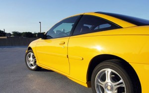 Yellow sports car side angle